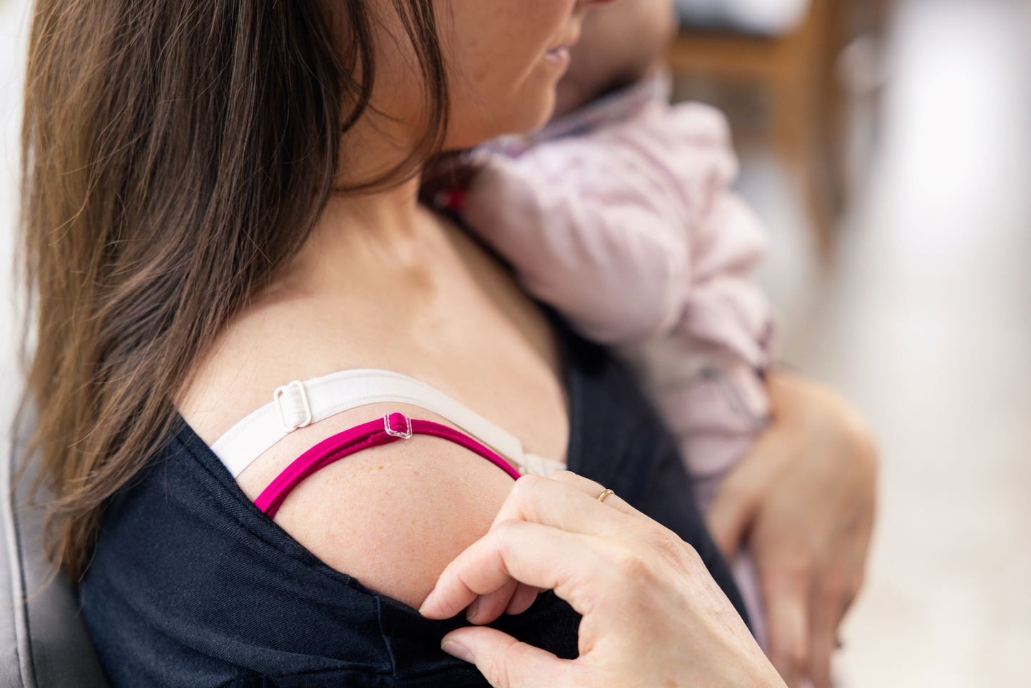 Breast Vest in pink, breastfeeding mum showing staps on shoulder